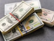 american-dollar-usa-packs-on-money-background-financial-conceptjpg